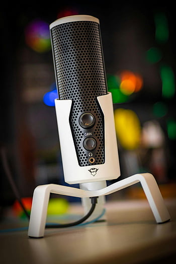 Trust microphone, black and white, sleek design, vibrant bokeh, colorful background, studio microphone, recording equipment, audio device, modern microphone, bokeh effect, white stand