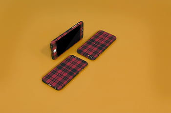 plaid phone cases, black plaid cases, pink plaid cases, plaid-patterned phone cases, bright yellow background, modern design cases, three phone cases, plaid design cases, stylish phone cases, protective phone cases, vibrant background cases