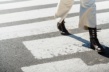woman crossing road, zebra crossing, stylish boots, city crosswalk, urban fashion, movement, asphalt road, crosswalk, fashion boots, city street, pedestrian crossing