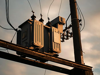 electricity boxes, electrical transformer, utility pole, sunset sky, close-up, power lines, electrical equipment, outdoor utility, electrical infrastructure, utility infrastructure, electrical components