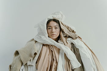 woman wrapped in fabrics, artistic portrait, neutral toned clothes, fashion photography, creative composition, fabric art, woman in clothes, neutral colors, fashion art, textile art, draped fabrics