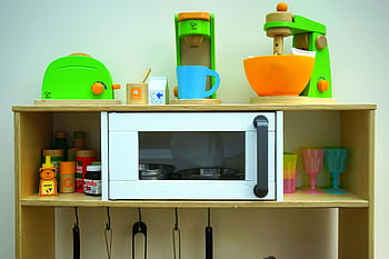 children's toy kitchen, wooden appliances, imaginative play, white oven, brown wooden rack, toy microwave, colorful utensils, toy kitchen set, wooden toys, play kitchen, vibrant toys