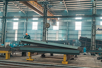 steel industry, man working, steel beams, factory setting, worker helmet, industrial worker, large factory, steel management, manufacturing plant, industrial environment, steel production