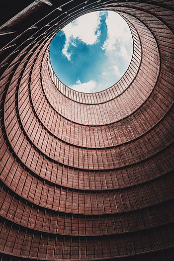 cooling tower, interior view, open sky, dramatic view, circular structure, architectural design, industrial building, spiral pattern, sky view, tower interior, open ceiling
