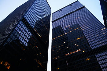 Toronto skyscrapers, worm's eye view, architectural photography, high-rise buildings, evening sky reflection, low angle view, dramatic perspective, urban skyline, modern architecture, cityscape, downtown Toronto