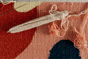 handmade carpet, weaving process, textile craftsmanship, yarn, shuttle, detailed view, creation process, unfinished carpet, textile art, craft, handmade textiles