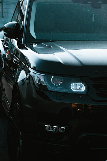 Black Range Rover, range rover sport, Osvětlené světlomety, luxusní design, detailní záběr na SUV, černá suv, Světlomety Range Roveru, luxusní vozidlo, špičkové auto, Moderní SUV, automobilového designu