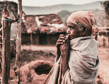 elderly woman, shawl, rural India, finger on mouth, outdoor, village, traditional clothing, aged, countryside, cultural, home