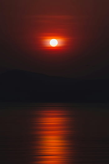 sunset, sea, mountains, vibrant sunset, water reflections, silhouette mountains, sunset over water, striking reflections, sunset landscape, sea sunset, mountain silhouette