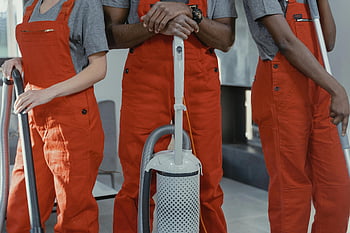 orange coveralls, cleaning tools, workers, red coveralls, vacuum cleaner, room, cleaning staff, maintenance workers, professional cleaning, team work, indoor cleaning