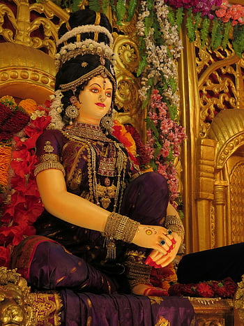 Hindu Goddess Statue, beautifully decorated, adorned jewelry, flowers, Jabalpur temple, goddess statue, temple decoration, religious icon, cultural art, divine figure, spiritual symbol