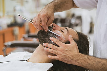 barber, straight razor, classic shave, facial grooming, barber shop, man shaving, beard care, professional shave, grooming services, men's grooming, shaving technique