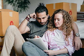 moving house, thoughtful couple, writing in notebook, home relocation, checklist, cozy bedroom, young couple, planning, moving boxes, attentive planning, home move