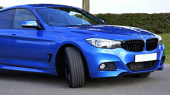 Blue BMW Car, luxury sedan, modern design, performance, shiny blue, outdoor parking, close-up, blue car, BMW, luxury vehicle, sedan