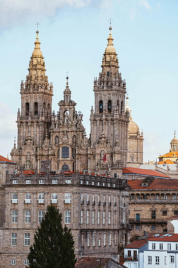 aerial photography, Cathedral of Santiago de Compostela, blue sky, Spain, captivating view, clear sky, Santiago de Compostela Cathedral, historic architecture, European cathedral, religious landmark, Galicia Spain