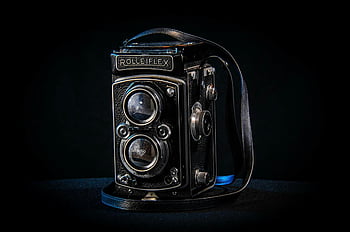 Rolleiflex, reflex a doppia lente, macchina fotografica d'epoca, design classico, sfondo scuro, Foto in primo piano, dispositivo nero, fotografia retrò, macchina fotografica antica, fotografia d'epoca, riflesso a doppia lente