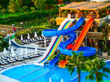 swimming pool, water park, multi-colored slides, summer fun, refreshing pool, bright water park, exciting slides, pool slides, outdoor water park, colorful slides, pool area