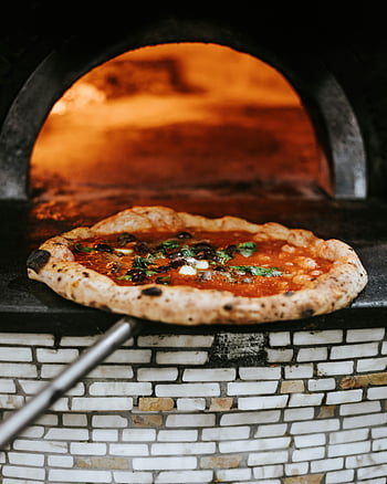 pizza, oven, Neapolitan pizza, wood-fired oven, freshly baked, Naples, Italian cuisine, pizza crust, tomato sauce, basil, cheese