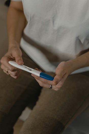 woman, pregnancy test, anticipation, emotion, close-up, holding, test kit, pregnant, results, waiting, moment