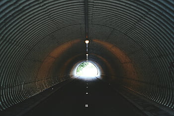 empty tunnel, dark urban tunnel, light at exit, moody atmosphere, mysterious atmosphere, tunnel interior, tunnel light, tunnel exit, urban tunnel, tunnel view, tunnel scene