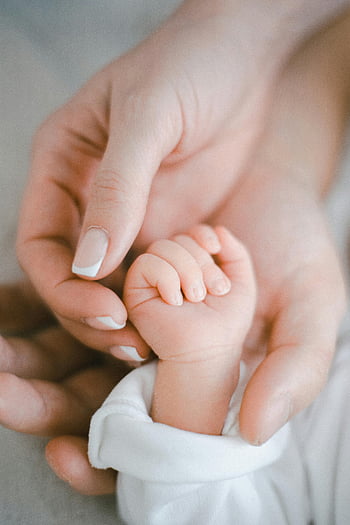parents and child hands, close-up hands, newborn hand, gentle touch, love and care, family bond, parent-child connection, tender moment, baby hand, holding hands, newborn photography