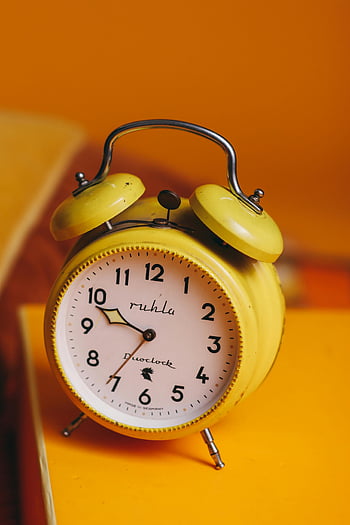 yellow alarm clock, retro alarm clock, classic alarm clock, vivid orange background, yellow and white, vintage clock, ruhla clock, duoclock, analog clock, yellow clock, retro style