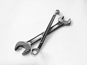 stainless steel, close wrench, spanner, metal wrenches, crossed wrenches, clean white surface, tool photography, industrial tools, mechanical tools, wrench pair, metal tools