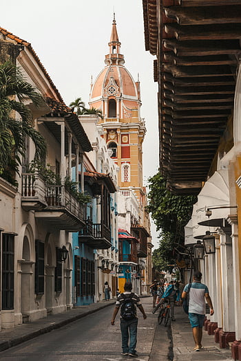 Cartagena de Indias, Cathedral of Cartagena, city street, scenic street scene, iconic cathedral tower, colonial architecture, historic city, street view, Cartagena Colombia, tourist destination, cultural landmark