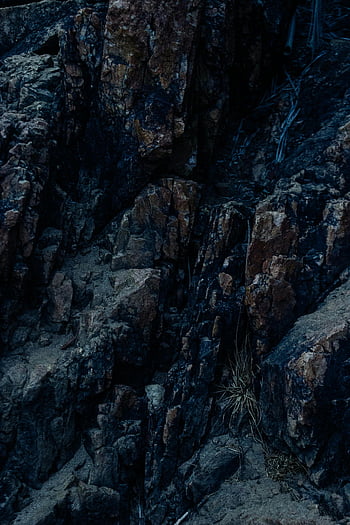 rocky formation, steep stone slope, rugged terrain, close-up view, texture, geology, rocky terrain, stone texture, natural landscape, geologic features, steep slope