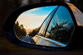 Black Car Wing Mirror, wet side mirror, dynamic reflection, road reflection, trees reflection, twilight scene, car mirror, wet mirror, road and trees, twilight reflection, car side mirror