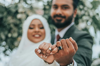 Indian wedding, couple rings, wedding rings, loving couple, commitment joy, Indian couple, showcasing rings, wedding joy, couple commitment, wedding celebration, Indian wedding celebration