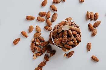 raw almonds, bowl, white background, healthy nuts, top view, scattered almonds, white surface, almond nuts, raw almond, healthy snack, nut bowl