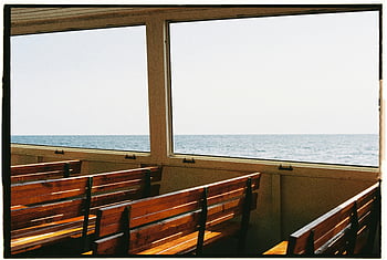 brown wooden bench, boat, ferry, ocean view, tranquil sea, calm ocean, wooden bench on ferry, sea view, ferry interior, ocean scenery, peaceful view