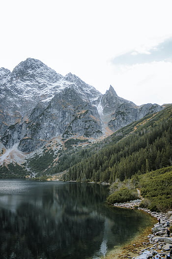 Tatra Mountains, Morskie Oko lake, Zakopane, Poland, Tatra National Park, tranquil landscape, majestic view, mountain reflection, forested slopes, alpine scenery, serene waters
