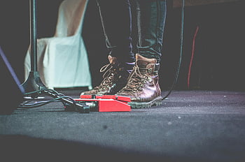 musician, leather boots, stage, pedals, guitar effect pedals, close-up, performance, music equipment, concert, footwear, musician's feet