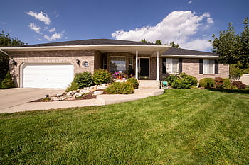 modern suburban house, landscaped yard, sunny day, green grass lawn, white and brown house, blue sky, exterior, beautiful yard, modern house, suburban home, sunny weather