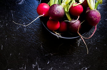 purple radish, red radish, black bowl, dark marble table, vibrant radishes, fresh vegetables, healthy food, organic produce, garden harvest, vegetable photography, food photography
