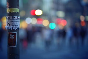 bokeh photography, pole poster, colorful urban nightlife, bokeh lights, city street, night scene, urban scene, street photography, night photography, city lights, poster on pole