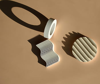 abstract geometric shapes, white objects, pink background, casting shadows, minimalist design, neutral surface, various shapes, abstract art, modern art, design concepts, minimalist photography