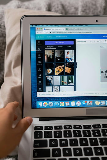 laptop, open browser, design software, creative work, close-up shot, Canva, image editing, photo editing, digital design, user interface, creative process