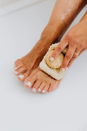 foot care, washing feet, loofah, exfoliation, close-up, maintenance, foot hygiene, skin care, scrubbing, toes, bath time
