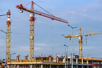 tower cranes, construction site, clear blue sky, yellow cranes, red cranes, large construction, blue sky backdrop, construction equipment, building site, industrial construction, crane construction