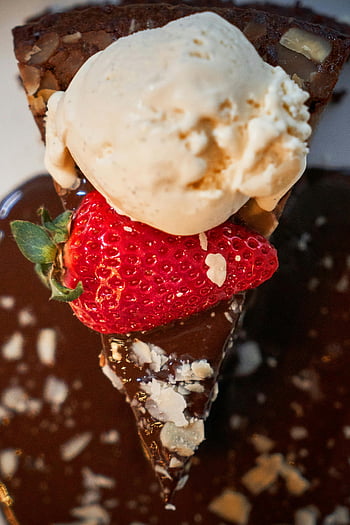 chocolate dessert, vanilla ice cream, fresh strawberry, rich dessert, chocolate topping, dessert photography, indulgent treat, dessert image, dessert close-up, dessert with ice cream, dessert with strawberry