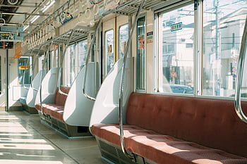 empty train, contemporary train, city train, sunny day, sunlit interior, red seats, modern design, urban transport, train interior, empty seats, modern train
