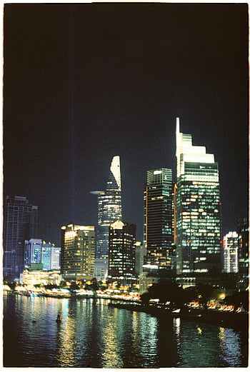 Ho Chi Minh, Vietnam, skyscrapers, illuminated skyline, night view, cityscape, river reflection, urban landscape, modern buildings, downtown Ho Chi Minh, night photography