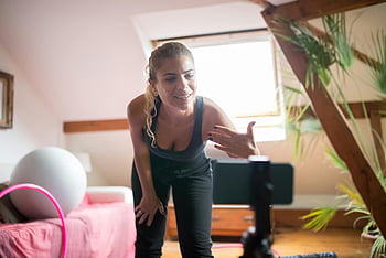 virtual fitness class, woman talking, online engagement, home workout, energetic instructor, virtual training, online fitness, home exercise, virtual class, online audience, fitness instructor
