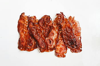 crispy bacon, bacon strips, fried meat, white surface, breakfast food, savory treat, crispy strips, bacon display, meat strips, breakfast bacon, fried bacon