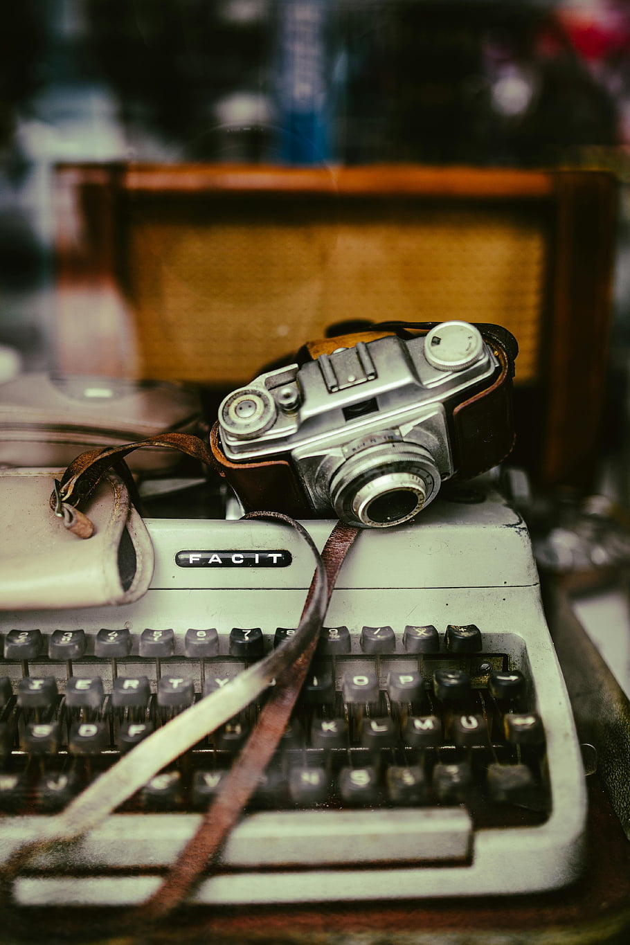 vintage typewriter, vintage camera, close-up shot, nostalgic, classic typewriter, retro, antique, facit typewriter, old camera, photography equipment, vintage photography