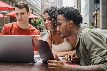 diverse friends, homework assignment, cafe, netbooks, collaborative learning, casual setting, outdoor study, laptops, young students, group study, urban environment