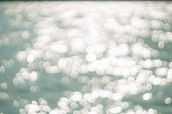 glistening water, sunlight reflection, bokeh effect, abstract image, water surface, soft bokeh, light reflection, water texture, natural light, bokeh photography, water bokeh